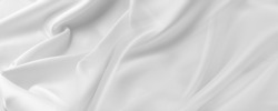 Closeup of rippled white silk fabric lines