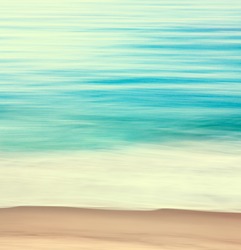 An abstract ocean seascape with blurred panning motion.  Image displays a retro look with cross-processed colors.