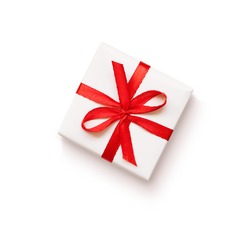 White gift with red ribbon on white background
