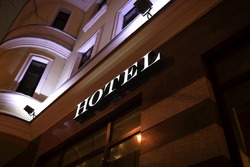 Details of hotel glowing signboard at night