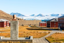 View to abandoned Russian arctic settlement with the bust of Lenin in the foreground in Pyramiden, Norway.