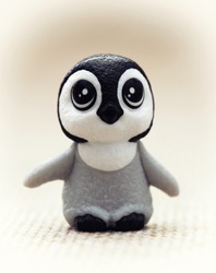 Plastic toy figurine - cute penguin cub.