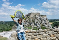 Beautiful woman with fluttering scarf on Devin castle. Slovakia, central Europe. 