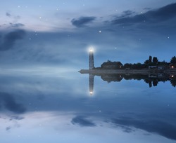Lighthouse and stars reflecting in sea
