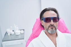 Close up of bearded man visiting beauty clinic