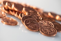 Two euro cents a lot of coins lie on a light background, close-up. Business concept. Web banner.