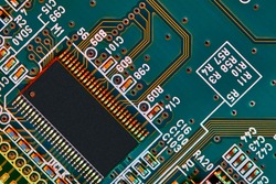 Electronic circuit board with electronic components such as chips close up.