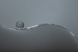Grey abstract background, bubbles on dark backgroud, oil drop in water