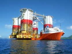 Heavy lift cargo ship transporting an oil rig