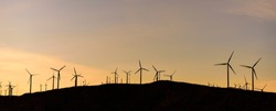Wide panorama of Windmills silhouette at dusk in Palm Springs, California, U.S.A.