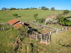 Aerial view of an old cattle wooden stable abandoned in Brazil