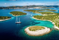 Aerial view of Paklinski Islands in Hvar, Croatia. Turquise water bays with luxury yachts and sailing boats. Toned image.