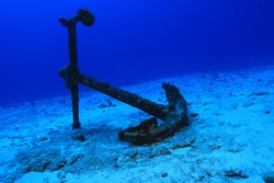 Anchor of old ship underwater on the bottom of the ocean 