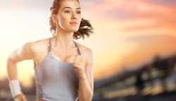girl in sport on the sunset background