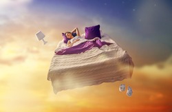 Woman's dreams. Pretty girl is flying in her bed trough star sky.