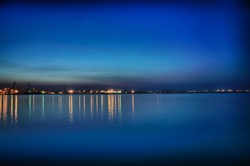 Night coastline, view from the pier of Odessa Sea Port. Ukraine.