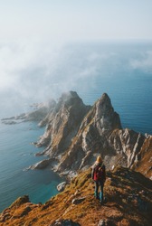 Woman hiking alone travel in Norway adventure vacations healthy lifestyle explore summer activity Vesteralen landscape rocks and sea aerial view