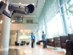 Security CCTV camera or surveillance system in office building, Intelligent cameras can record video all day and night to keep you safe from thieves. Surveillance camera Anti-thieft system concept.