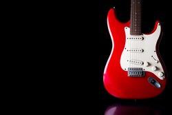 Electric guitar on black background. Free space for text