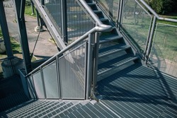 external staircase with double flight, for public pedestrian passages, in fireproof galvanized steel. External emergency staircase in case of fire, evacuation route. particular architecture.