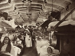 British WW1 wounded evacuated from France in a hospital train. 1914-18. Ambulances will transfer them to the base hospital.