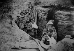 Bandaged British World War 1 soldiers in a battlefield trench, 1915-1918.