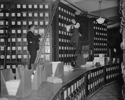 Clerks working in Capitol Document Room where all bills were kept on file, Nov. 9, 1937.