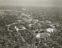 Capitol Hill transformed by new 1930's buildings. Aerial view to northwest. The additions include Library of Congress Adams building, House and Senate office buildings, and the Supreme Court. On the n