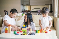 Asian happy family kids playing in the room