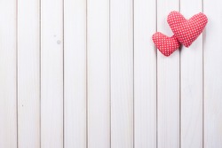 Heart on white wood background