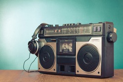 Retro ghetto blaster cassette tape recorder front mint green background