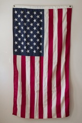 American Flag Hangs on Wall