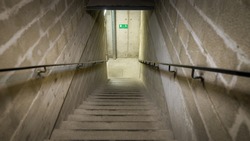 An image of stairs down to the basement