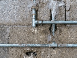 An image of an old water pipe repair