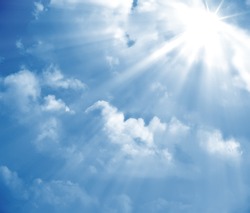 A photography of a blue sky with sun rays