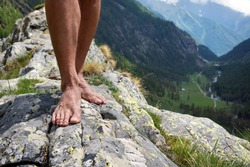 barefooted on big stone mountains