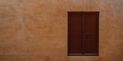 Travel destinations and heritage village of old Dubai. window of old Emirati House in Al Seef