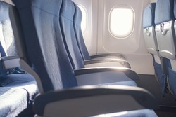 Empty seat on airplane while covid-19 outbreak destroy travel and airline business, health care and travel concept.