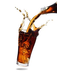 Pouring cola from bottle into glass with splashing., Isolated white background.