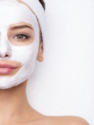 Adult woman relaxing in spa salon with cosmetic mask on face. Beauty treatment