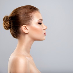 Profile face of  young  woman - isolated. Profile portrait of a  face of the young pretty girl.  Skin care concept. 
