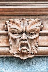 A gargoyle's head carving situated on a building in the Swedish city of Helsingborg.