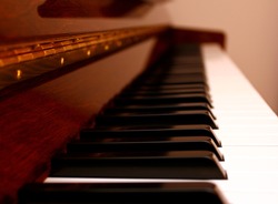 Close up perspective view of a wooden piano