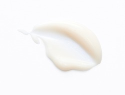 White cream swipe isolated on white background. Makeup foundation smudge. BB, CC cream texture