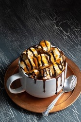 Hot Chocolate Cocoa Drink or Coffee in Large Mug Topped with Toasted Marshmallows and Chocolate Sauce