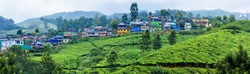 Panoramic beautiful village and tea plantations in Munnar, Kerala, India.