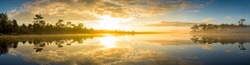 Panoramic view of sunrise over the lake in nation park, Beautiful rainforest landscape with fog in morning, Thailand 
