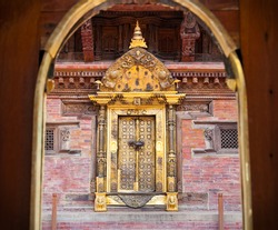 Carved golden door on Mul Chowk at Durbar Sqaure in Patan, Lalitpur city,  Nepal.