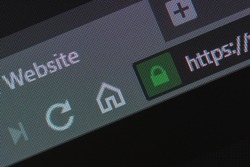 Web browser closeup on LCD with secure https url and visible pixels. Internet security, SSL certificate, cybersecurity, search engine and web browser concepts