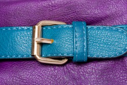 Blue faux leather strap on violet woman's bag